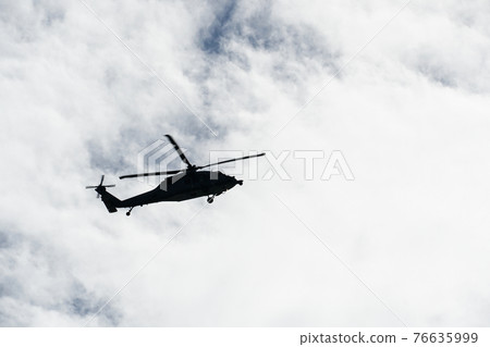 Sheriff Helicopter Hovering on a Beautiful Sky Background 76635999