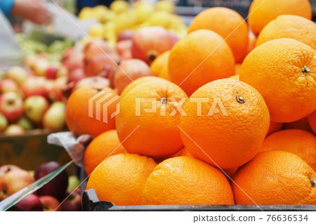 Oranges in the market close-up on the market counter. 76636534