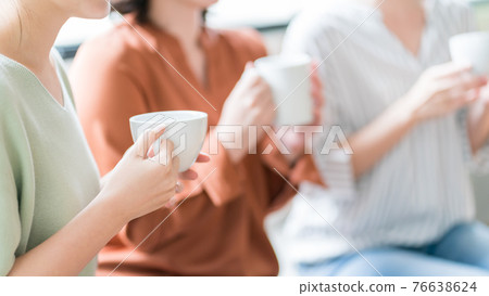 Tea with a girl friend at home Tea with a girl friend at home 76638624