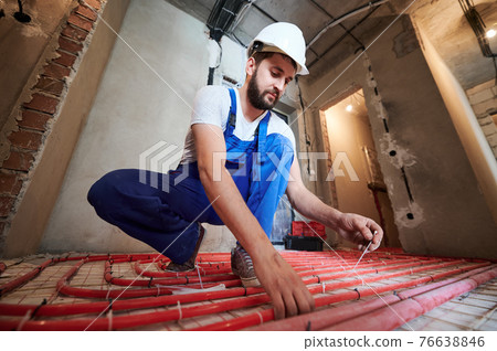 Underfloor heating installation. Warm floor heating system Underfloor heating installation. Warm floor heating system 76638846