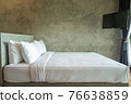 White pillows on a bed Comfortable soft pillows on the bed. 76638859