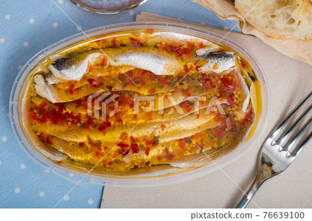 Marinated herring fillet in a plastic jar Marinated herring fillet in a plastic jar 76639100