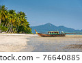 long tail boat at beach in Thailand. 76640885