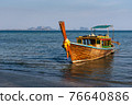 long tail boat at beach in Thailand. 76640886