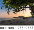 silhouette photography of beach cradle on tree against beautiful sun set lighting 76640888
