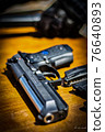 Gun waiting for turn 76640893