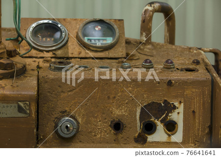 Old parts, damaged tractors have been left to rust. 76641641