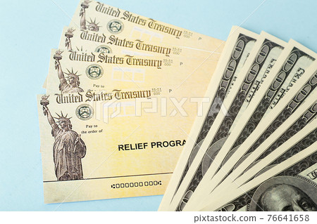 USA dollars background. American rescue plan, USA relief program, stimulus check and Act of 2021 concept. Money, business, profit and livelihood idea USA dollars background. American rescue plan, USA relief program, stimulus check and Act of 2021 concept. Money, business, profit and livelihood idea 76641658
