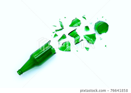 Broken green bottle on white 76641858