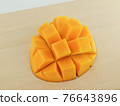Cut apple mango 76643896