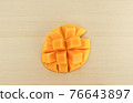 Cut apple mango 76643897