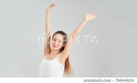 portrait of woman with hands up, isolated on white 76644024