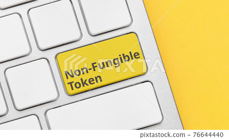 Concept type of cryptographic non-fungible tokens on the keyboard button. 76644440