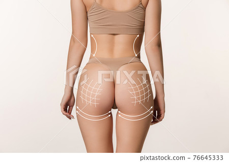 Beautiful female body in underwear over white background. Beauty fitness concept Beautiful female body in underwear over white background. Beauty fitness concept 76645333