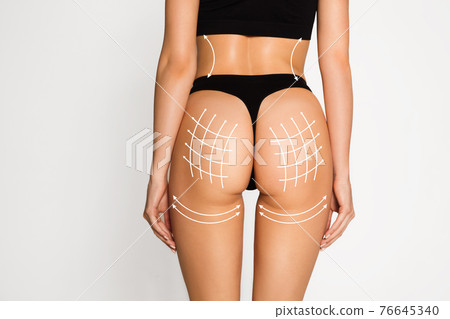 Beautiful female body in underwear over white background. Beauty fitness concept Beautiful female body in underwear over white background. Beauty fitness concept 76645340