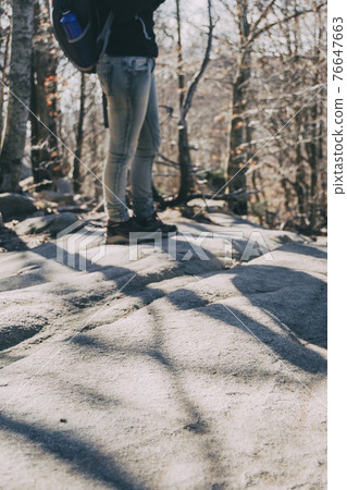 Close-up of womans legs in hiking boots 76647663
