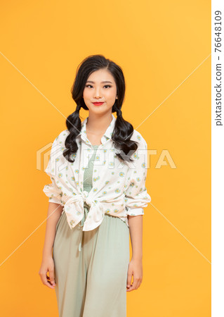 Asian business woman with straight pony tail hair style in summer clothes with high heel shoes Asian business woman with straight pony tail hair style in summer clothes with high heel shoes 76648109