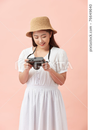 Young pretty hipster cheerful girl posing, having fun alone, travel concept Young pretty hipster cheerful girl posing, having fun alone, travel concept 76649640