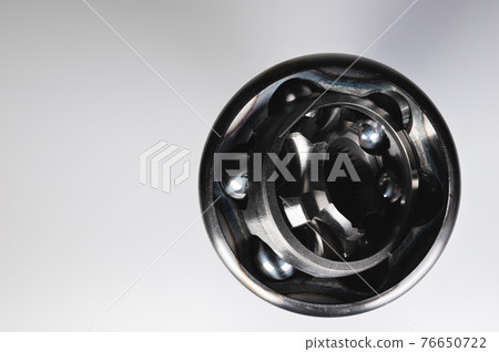 demo internal mechanism, Close-up constant-velocity universal spheric joint new on gray background. demo internal mechanism, Close-up constant-velocity universal spheric joint new on gray background. 76650722