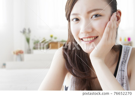 A lady with a cheeks stick A lady with a cheeks stick 76652270