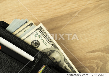 Laptop and wallet with credit card and cash money on a wooden desktop, online payment systems and banking concept. Laptop and wallet with credit card and cash money on a wooden desktop, online payment systems and banking concept. 76655618