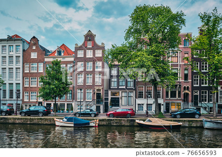 Singel canal in Amsterdam with houses. Amsterdam, Netherlands 76656593