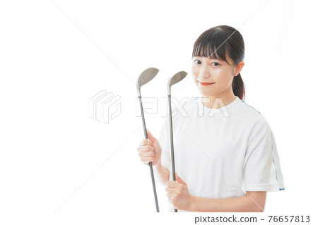Young woman with a golf club 76657813