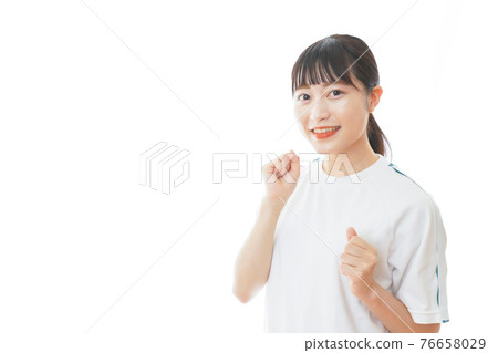 Young woman running in gym clothes Young woman running in gym clothes 76658029