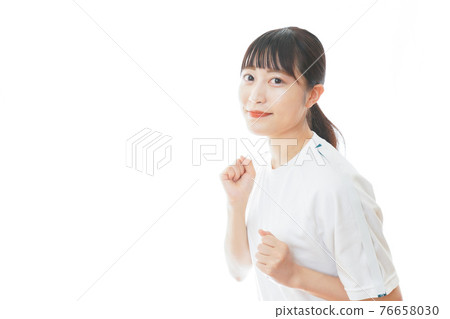 Young woman running in gym clothes Young woman running in gym clothes 76658030