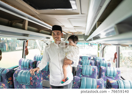 asian muslim man and daughter doing eid mubarak traveling asian muslim man and daughter doing eid mubarak traveling 76659140