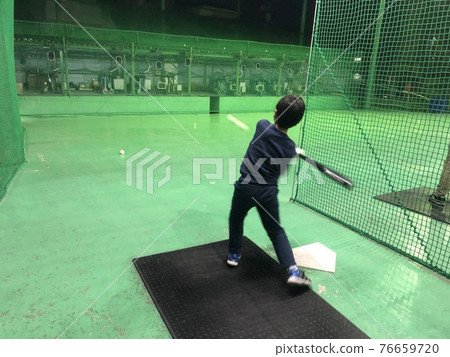 Children practicing at the batting cage 76659720