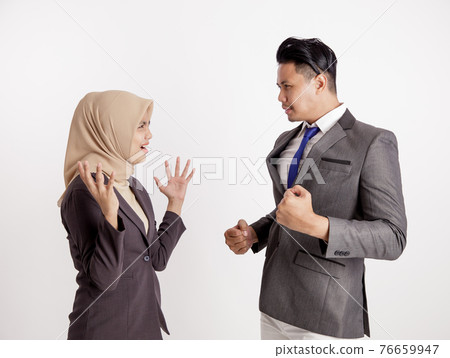 two young business colleagues playful work in office concept two young business colleagues playful work in office concept 76659947