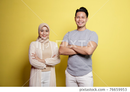 hijab women and men smiling crossed arms looking at camera hijab women and men smiling crossed arms looking at camera 76659953