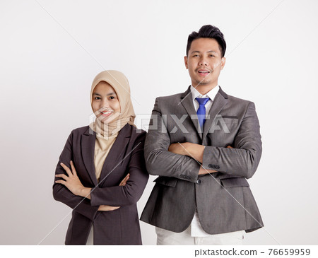 two young couples business smiling crossed arms looking at the camera two young couples business smiling crossed arms looking at the camera 76659959