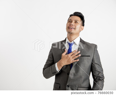 businessman relax expression holding chest office work concept. businessman relax expression holding chest office work concept. 76660030