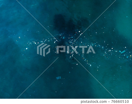 Ocean water and plastic trash, aerial view. Top view of paradise island with rubbish 76660510