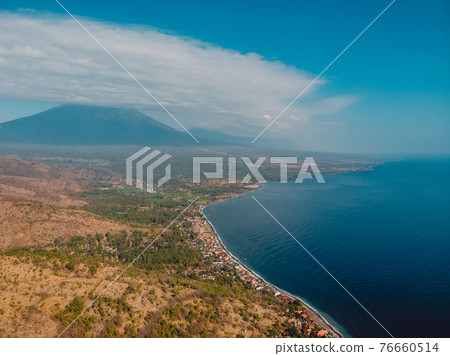 Aerial view with mountains nearly Amed village in Bali island Aerial view with mountains nearly Amed village in Bali island 76660514