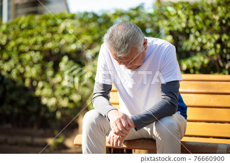 Senior man tired outdoors 76660900