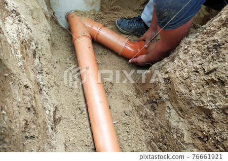 A locksmith supplies a sewer pipe to the sump. A locksmith supplies a sewer pipe to the sump. 76661921