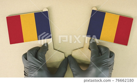 Flags of Romania made of recycled paper on the cardboard table Flags of Romania made of recycled paper on the cardboard table 76662180