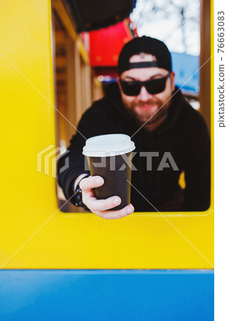 bearded man give to disposable paper cup bearded man give to disposable paper cup 76663083