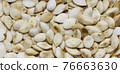 Roasted pumpkin vegetable seeds. 76663630