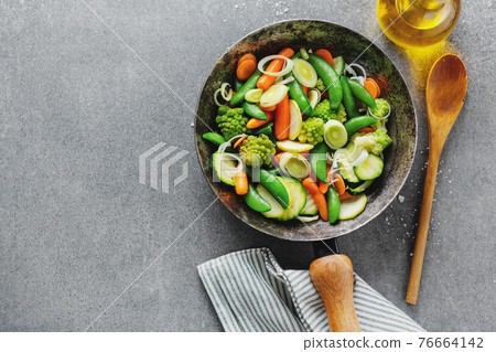 Vegan vegetables on pan on table Vegan vegetables on pan on table 76664142