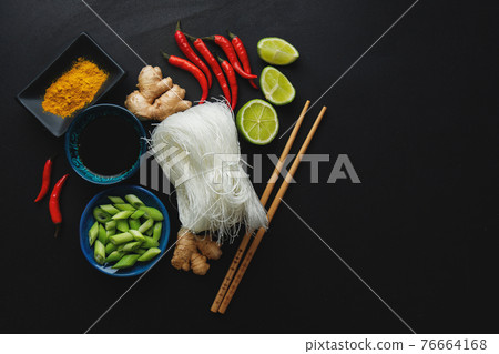 Asian food ingredients on dark background 76664168