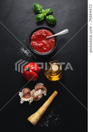 Italian food background with tomato sauce 76664472