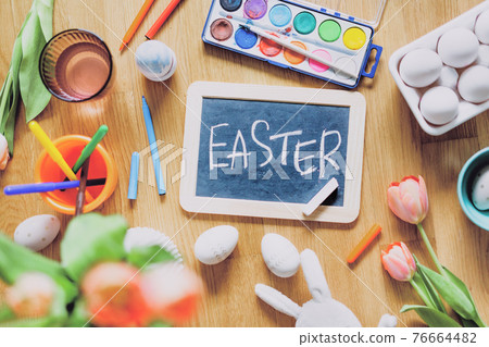 Paiting tools for easter eggs on table Paiting tools for easter eggs on table 76664482
