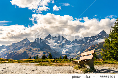Bench at a scenic trail near Zermatt, Switzerland Bench at a scenic trail near Zermatt, Switzerland 76665104
