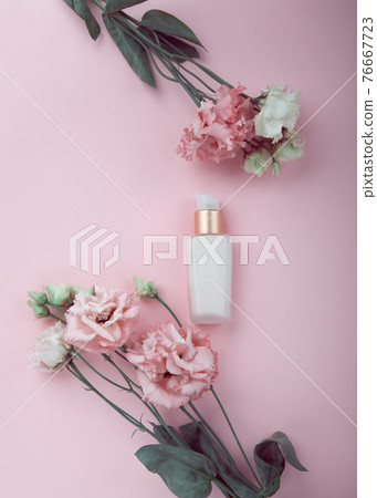 Face cream with fresh pink and white flowers, flatlay on pink background Face cream with fresh pink and white flowers, flatlay on pink background 76667723