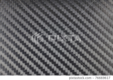 Black carbon kevlar fiber background. 76669617