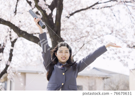 Graduation image of a high school girl who hurrays with a diploma Graduation image of a high school girl who hurrays with a diploma 76670631